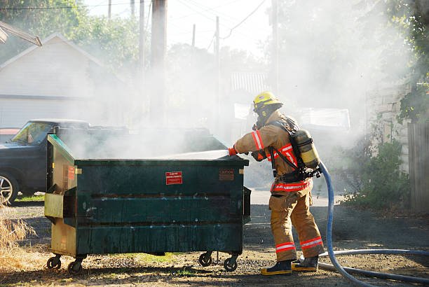 dumpster fire in an alley in roseburg oregon